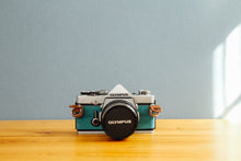 ç»åãã®ã£ã©ãªãŒãã¥ãŒã¢ã«èªã¿èŸŒã, OLYMPUS OM-1 èŒã®æç©ºðãå®ååã