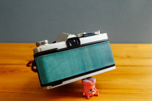 ç»åãã®ã£ã©ãªãŒãã¥ãŒã¢ã«èªã¿èŸŒã, OLYMPUS OM-1 èŒã®æç©ºðãå®ååã