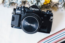 Load image into Gallery viewer, 📸Canon A-1 + FD 50mm f1.4 S.S.C✨ 初心者さんもOK！多彩な撮影モードで楽しめる名機セット
