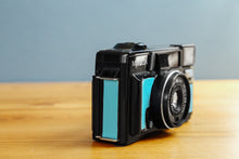 Load image into Gallery viewer, Minolta Hi-matic AF2-MD Ice Blue ❄️ [In working order]
